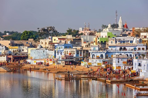 PUSHKAR, INDIA, NOVEMBER 20, 2012: Hindu devotees pilgrims bathing in sacred Puskhar lake (Sagar)