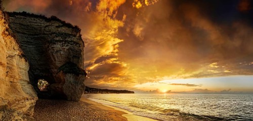 Sunset beach of Mare di Tropea under luminous sky, Tropea, Vibo Valentia, Calabria, Southern Italy,