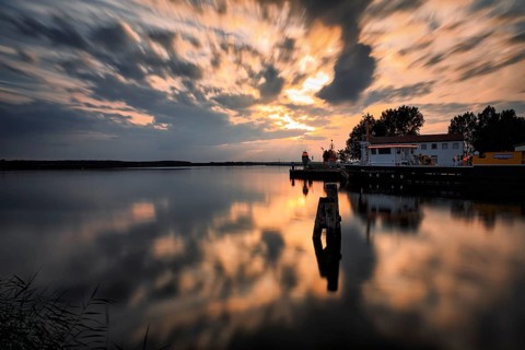 Harbour entrance at the Peenestrom, sunset, backlight, long exposure, marina, fishing port