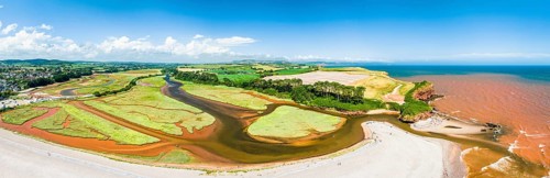 Panorama over River Otter Estuary Nature Reserve from a drone, Budleigh Salterton Beach, Devon,