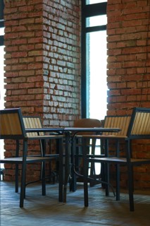 Small table with chairs around it in grunge bar