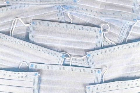 White protective disposable medical face masks background