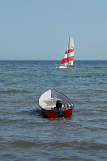 Sailing boat in front of the south beach, Göhren, Rügen Island, Mecklenburg-Western Pomerania,