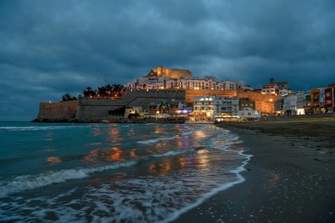 Old town with the Romanesque castle from the 14th century, blue hour, Peñíscola, province