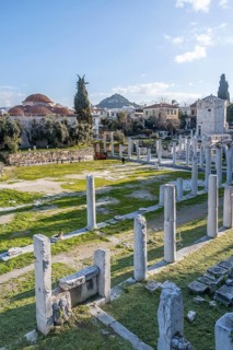 Columns of the Roman Agora of Athens, Tower of the Winds at the back, Athens, Attica, Greece,