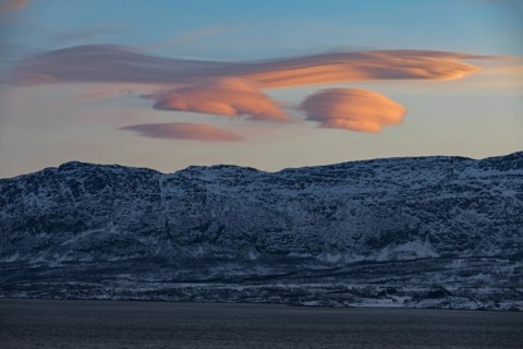 Lenticular clouds, Altocumulus lenticularis in winter in Norway, twilight, pink