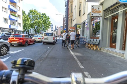Cycling from a first-person perspective on a cycle path in Cologne, North Rhine-Westphalia,