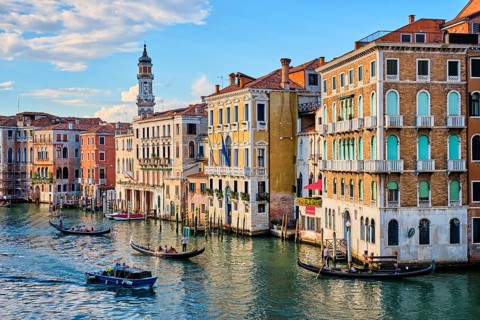 VENICE, ITALY, JUNE 27, 2018: Grand Canal with boats and gondolas on sunset, Venice, Italy, Europe