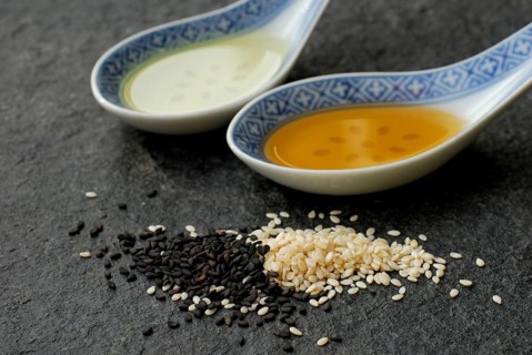 White Sesame (Sesamum indicum) and black, oil, spoon