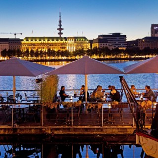 People on the restaurant ship Bootshaus Alster on the Inner Alster Lake in the evening, Hamburg,