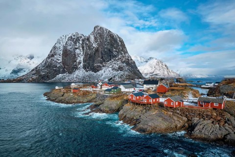 Hamnoy fishing village with red rorbu houses in Norwegian fjord in winter. Lofoten Islands, Norway,