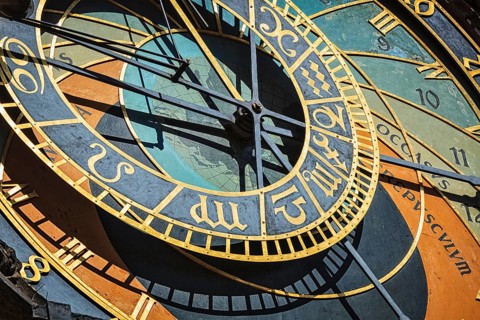 Famous astronomical clock on Town Hall. Prague, Czech Republic. The text is is occasus (sunset),