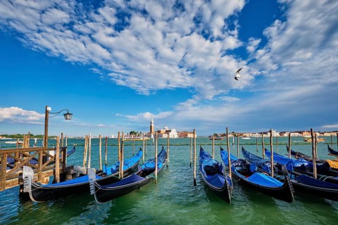 Gondolas and in lagoon of Venice by Saint Mark (San Marco) square with San Giorgio di Maggiore