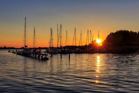 Sailing boats at sunset, waterway rest area, backlight, Wustrow harbour, Saaler Bodden, Fischland,