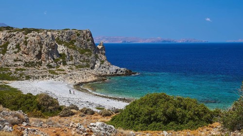 Agios Pavlos beach, pebble beach, barren rocks, trees, blue sea, green sea, Gramvoussa peninsula,
