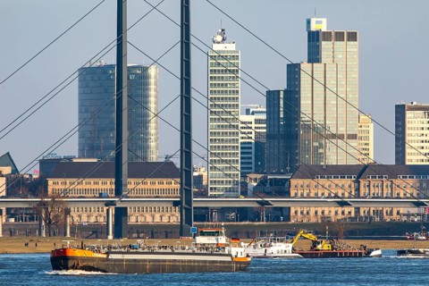 Düsseldorf, city centre skyline, skyscrapers, Rheinkniebrücke, Rhine, cargo ship