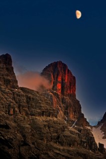 Alpine glow at sunset over Monte Cristallo mountain in the Dolomites, Italy, Europe