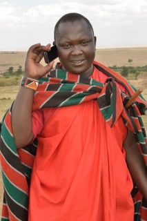Maasai on the phone, Massai Mara, Enkutoto, Serengeti, Rift Valley province, Kenya, Africa