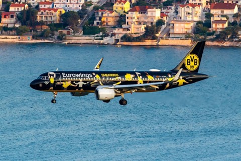 A Eurowings Airbus A320 aircraft with the registration number D-AEWM and the Borussia Dortmund