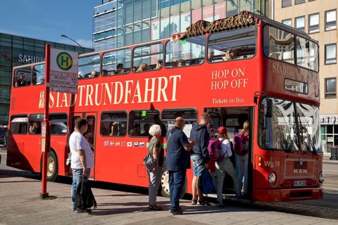 People boarding the red double-decker city tour bus, Hamburg, Germany, Europe