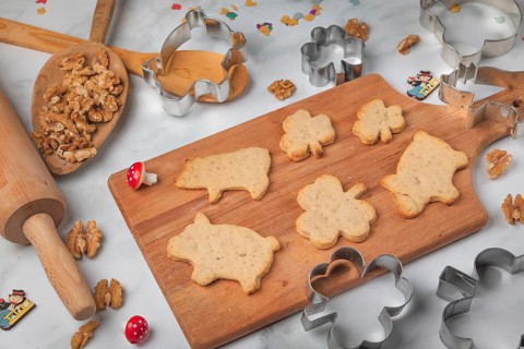 Baked biscuits for New Year, shamrocks and pigs, baking accessories