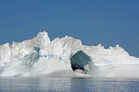 Iceberg with large ice cave, Ilulissat, Disko Bay, Denmark, Greenland, North America