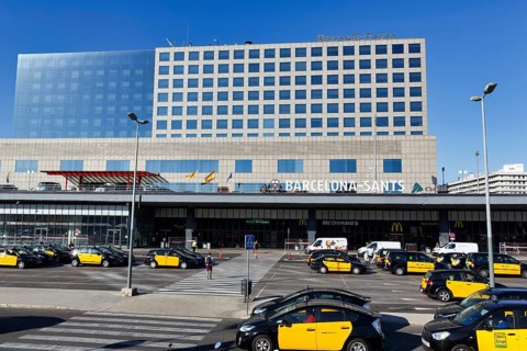 Black and yellow taxis in front of the station building, Barcelona-Sants Central Station,