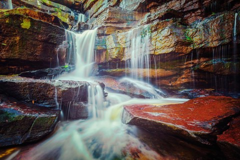 Vintage retro effect filtered hipster style image of tropical waterfall. Popokvil Waterfall, Bokor