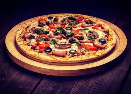 Vintage retro effect filtered hipster style image of ham pizza with (capsicum), mushrooms, olives