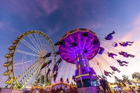 Chain carousel in the evening, Stuttgart Folk Festival at the Cannstatter Wasen. Around 260 showmen
