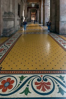 Floor mosaic in the arcade of the Palazzo della Borsa, built between 1907 and 1912, in Piazza de
