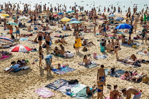 Crowded beach with people in August, San Sebastian, Donostia, Basque Country, Northern Spain,