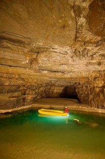 Karst cave, lake, rubber dinghy, speleologist, Krizna jama, Cerknica, Carniola, Slovenia, Europe