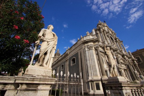 Super wide angle, oblique from below, sculpture, cathedral, blue sky, white clouds, Catania, Old