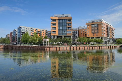 New buildings on the Motlawa River, Stara Stocznia, Gdansk, Pomeranian Voivodeship, Poland, Europe