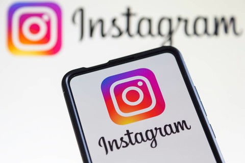 Instagram logo social media on a mobile phone and computer screen