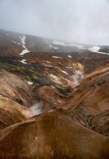 Steaming streams between colourful rhyolite mountains, Hveradalir geothermal area, Kerlingarfjöll,