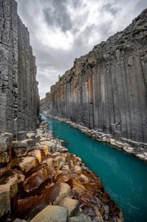 Stuðlagil Canyon, turquoise river between basalt columns, Egilsstadir, Iceland, Europe