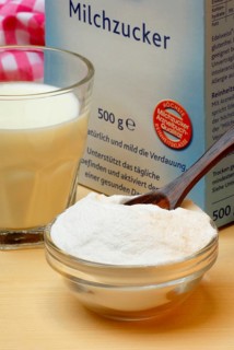 Glass of milk and bowl with lactose, lactose, sugar