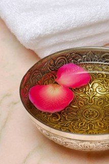 Bowl with massage oil and rose petals, massage oil, rose petals, oil, rose petals