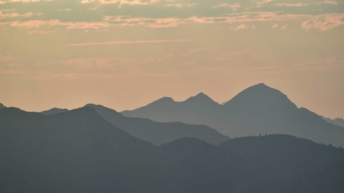 Silhouette of the Sonntagshorn, highest mountain of the Chiemgau Alps, in the backlight, Bavaria,