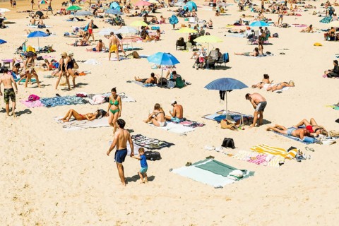 Crowded beach with people in August, San Sebastian, Donostia, Basque Country, Northern Spain,