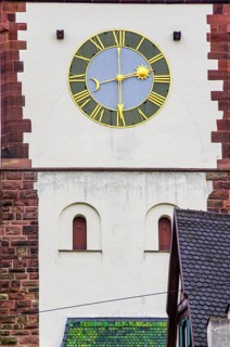 Old historic clock at the medieval Schwabentor, historic old town of Freiburg im Breisgau,