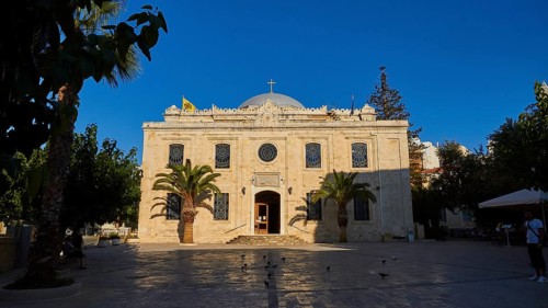 Agios Titos Church, facade, forecourt, palm trees, blue cloudless sky, city centre, old town,
