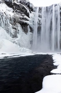 Skogafoss waterfall, snowy and icy rock face, Sudurland, Iceland, Europe