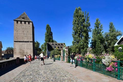 Strasbourg, France, September 2023: People crossing beautiful historic 'Ponts Couvert' bridge with