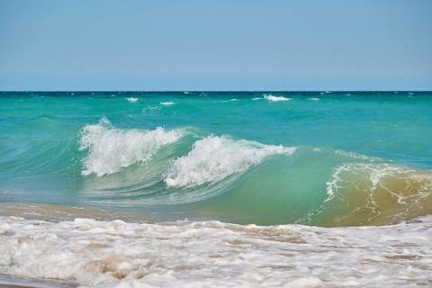 Breaking waves on a sandy beach, sunny, near Tarragona, Catalonia, Spain, Europe