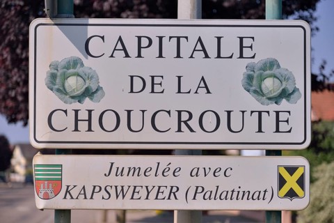 Sign "Capitale de la Choucroute", the capital of sauerkraut, on the village boundary of