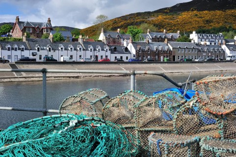 Stacked lobster traps, traps in Ullapool harbour, Highlands, Scotland, UK