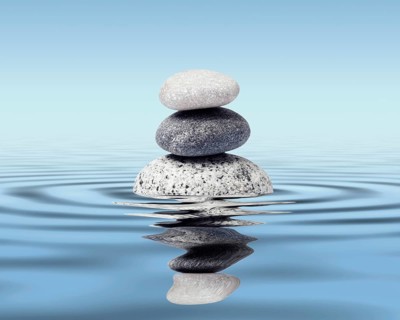 Zen stones in water with reflection, peace balance meditation relaxation concept